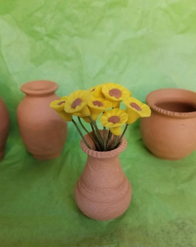 Mini florero del barro
